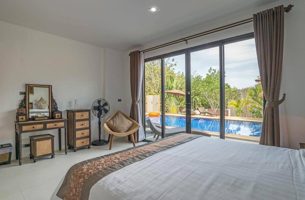 patio doors leading directly to the swimming pool